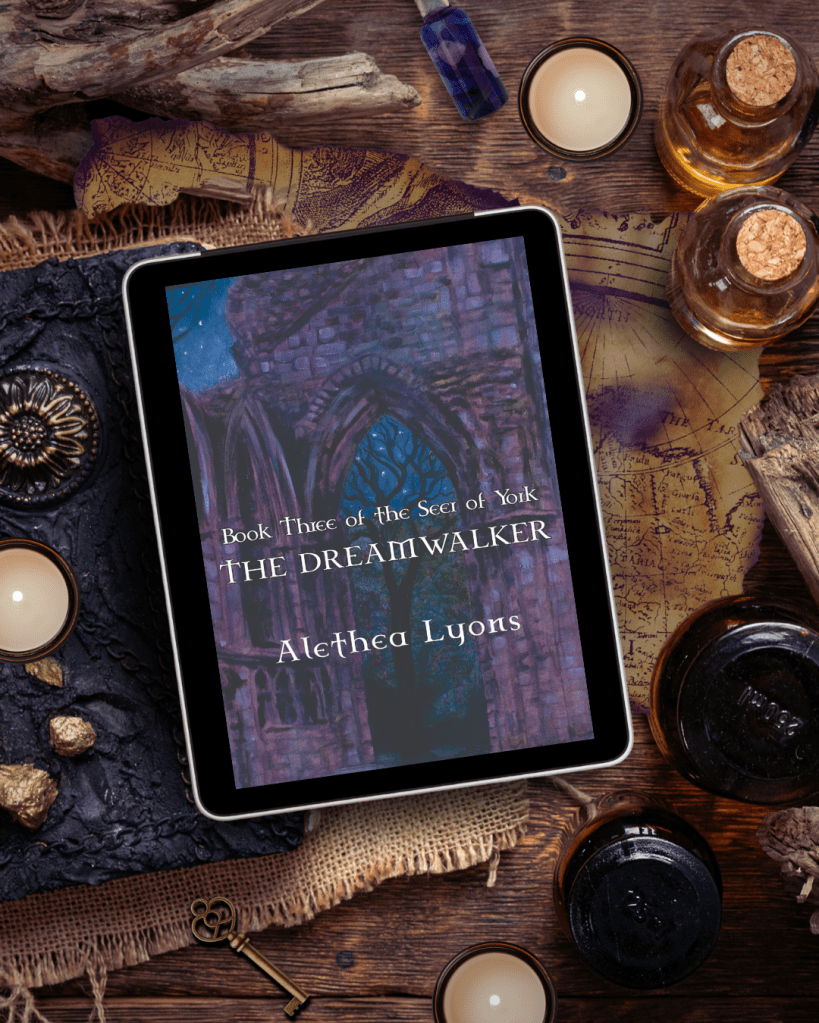 Book cover on tablet screen, sitting on table with vintage maps, trinkets and cork topped bottles